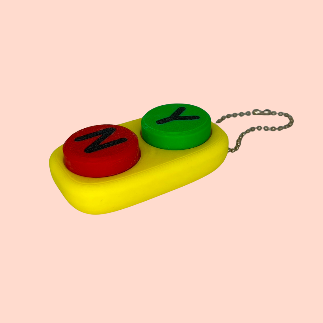Colorful keychain with letters 'Z' and 'Y' on a pink background