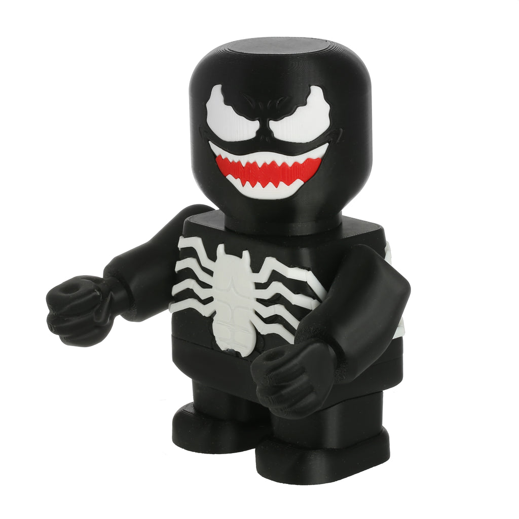 Black superhero figurine with white spider design and red mouth on a white background