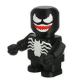 Black superhero figurine with white spider design and red mouth on a white background