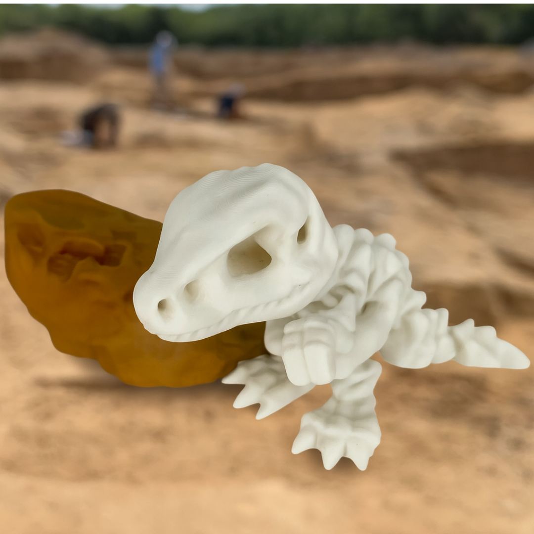 White dinosaur skeleton model on a brown surface with a blurred background of people and excavation equipment.