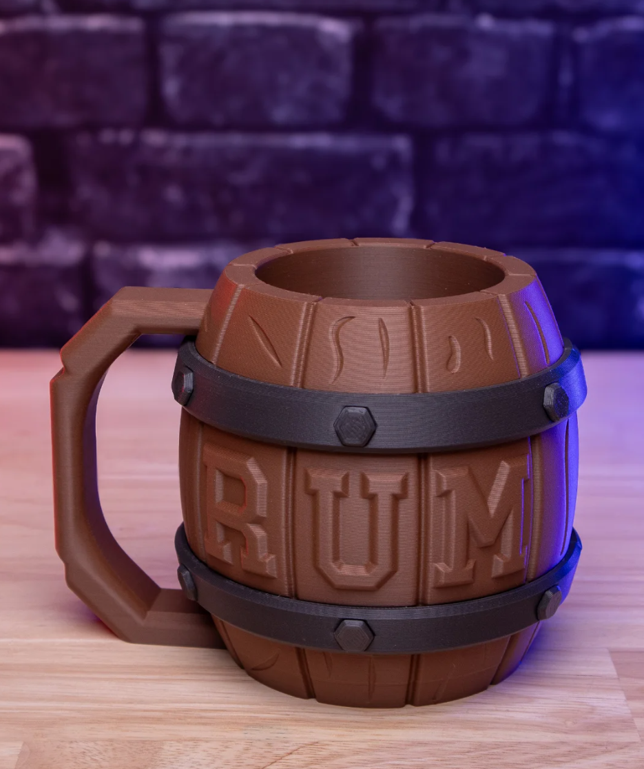 Brown barrel-shaped mug with 'RUM' text on a wooden surface and blurred brick wall background